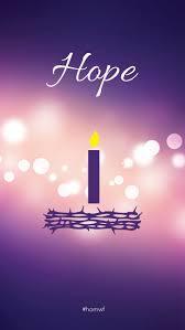 a purple single lit candle above a crown of thorns with the word hope