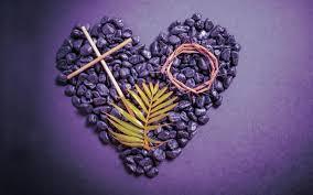 purple heart made of seeds with cross, palm frond, crown of thorns